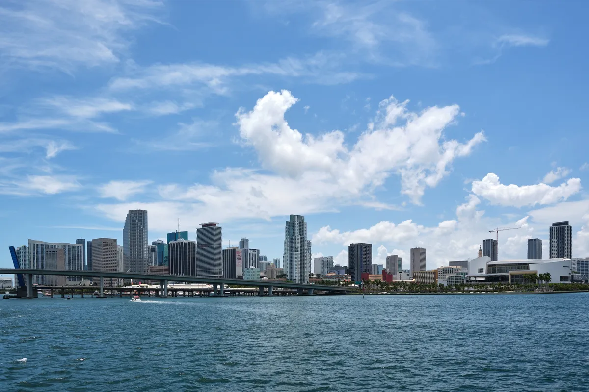 The Miami skyline across Biscayne Bay, with high-rise towers along the waterfront.